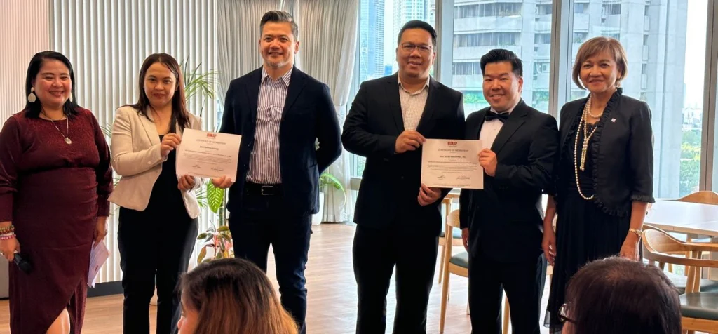Mel Planas and Michael Ching receive HIMAP's membership certification